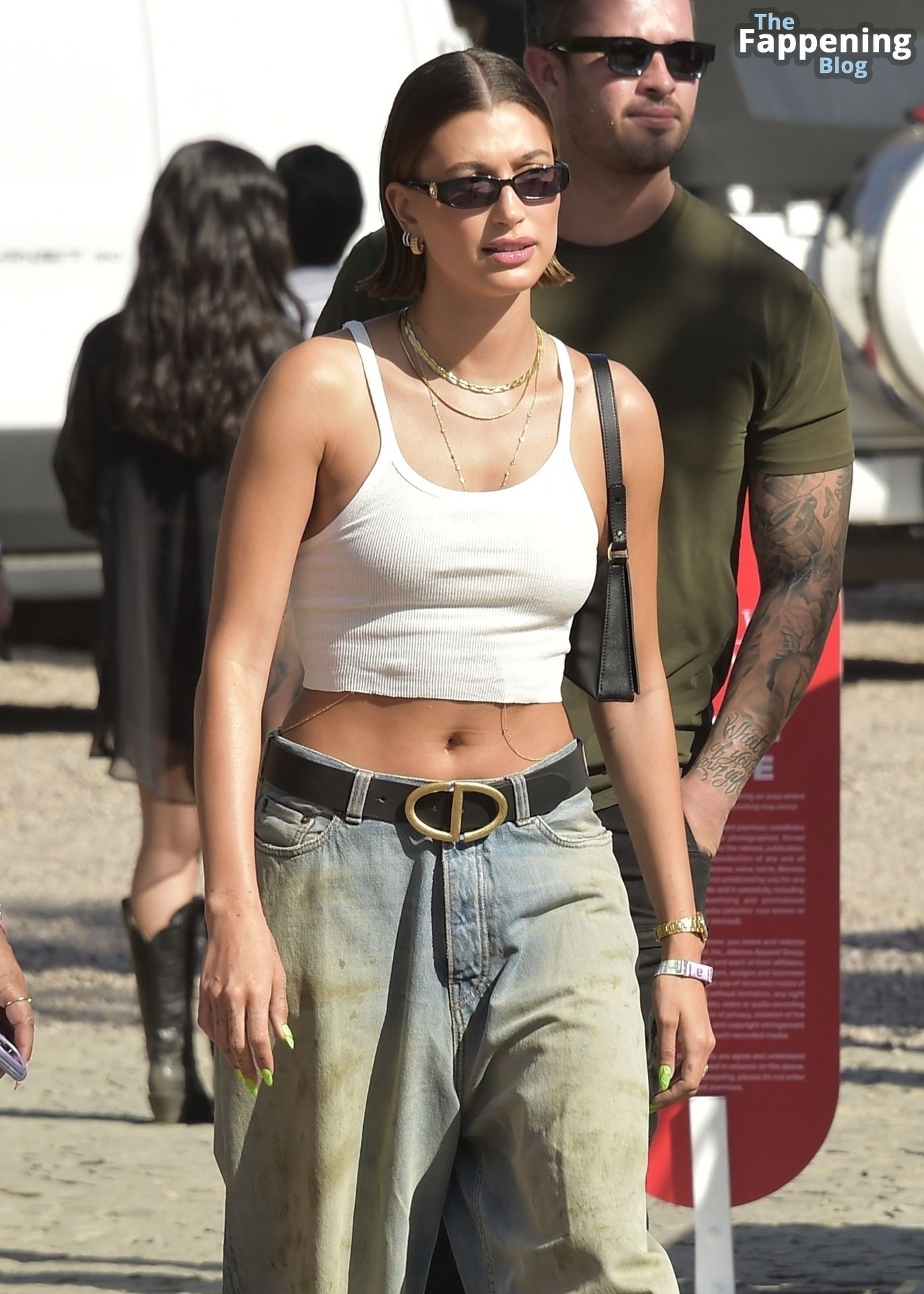 Hailey Bieber Shows Off Her Tummy as She Arrives at.jpg