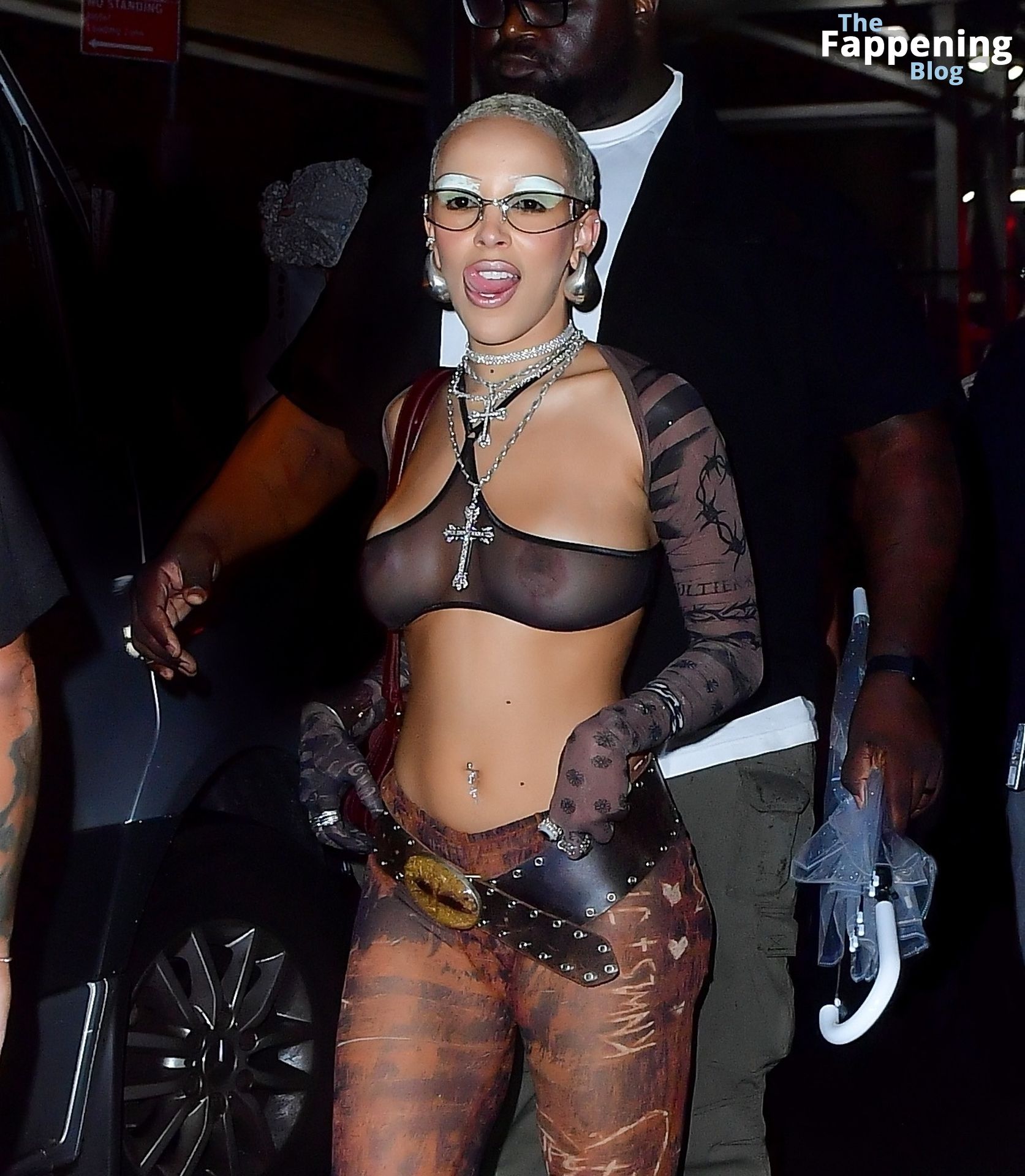 Doja Cat Flashes Her Nude Tits While Partying at Fashion.jpg