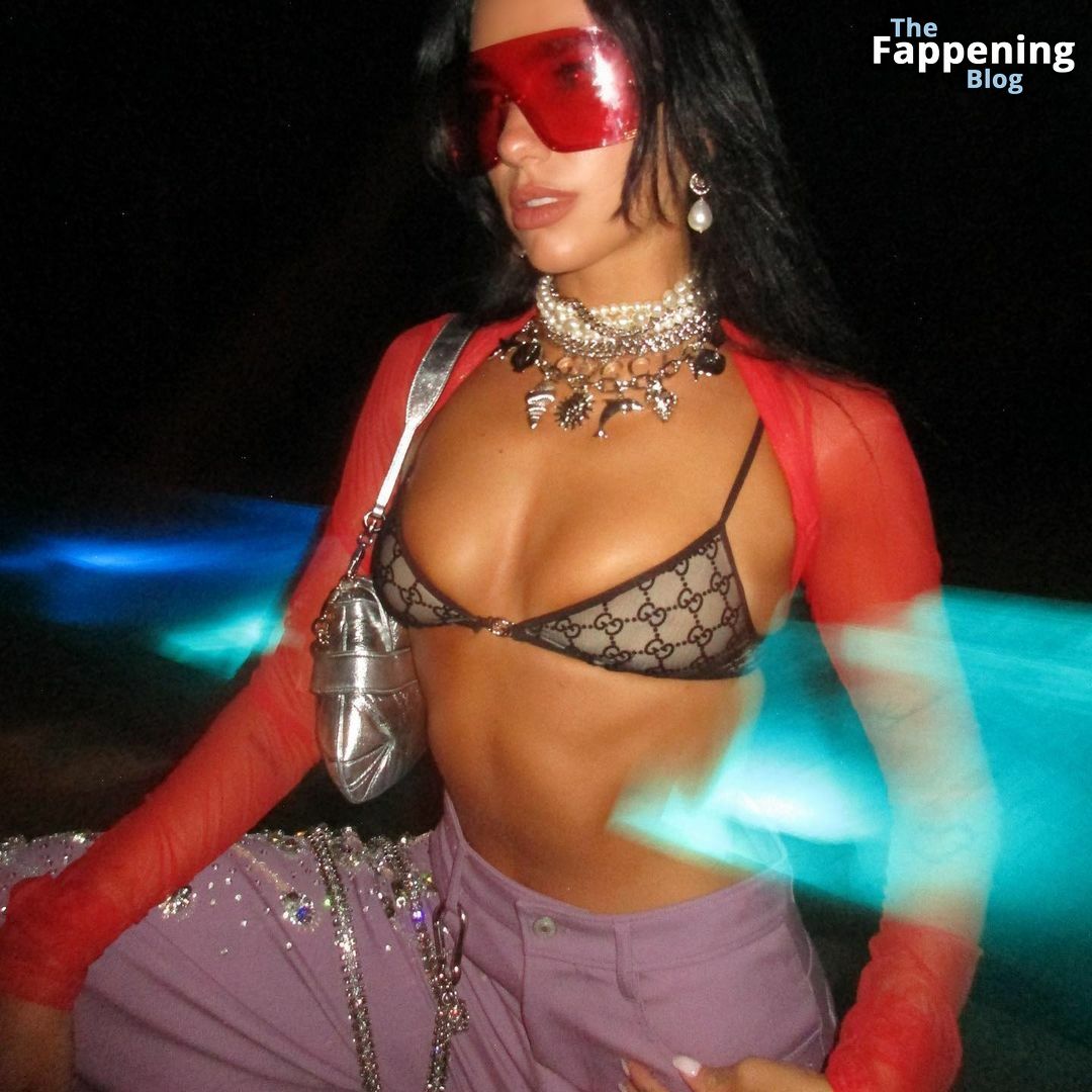 Dua Lipa Displays Her Small Tits in a Bra Top.jpg