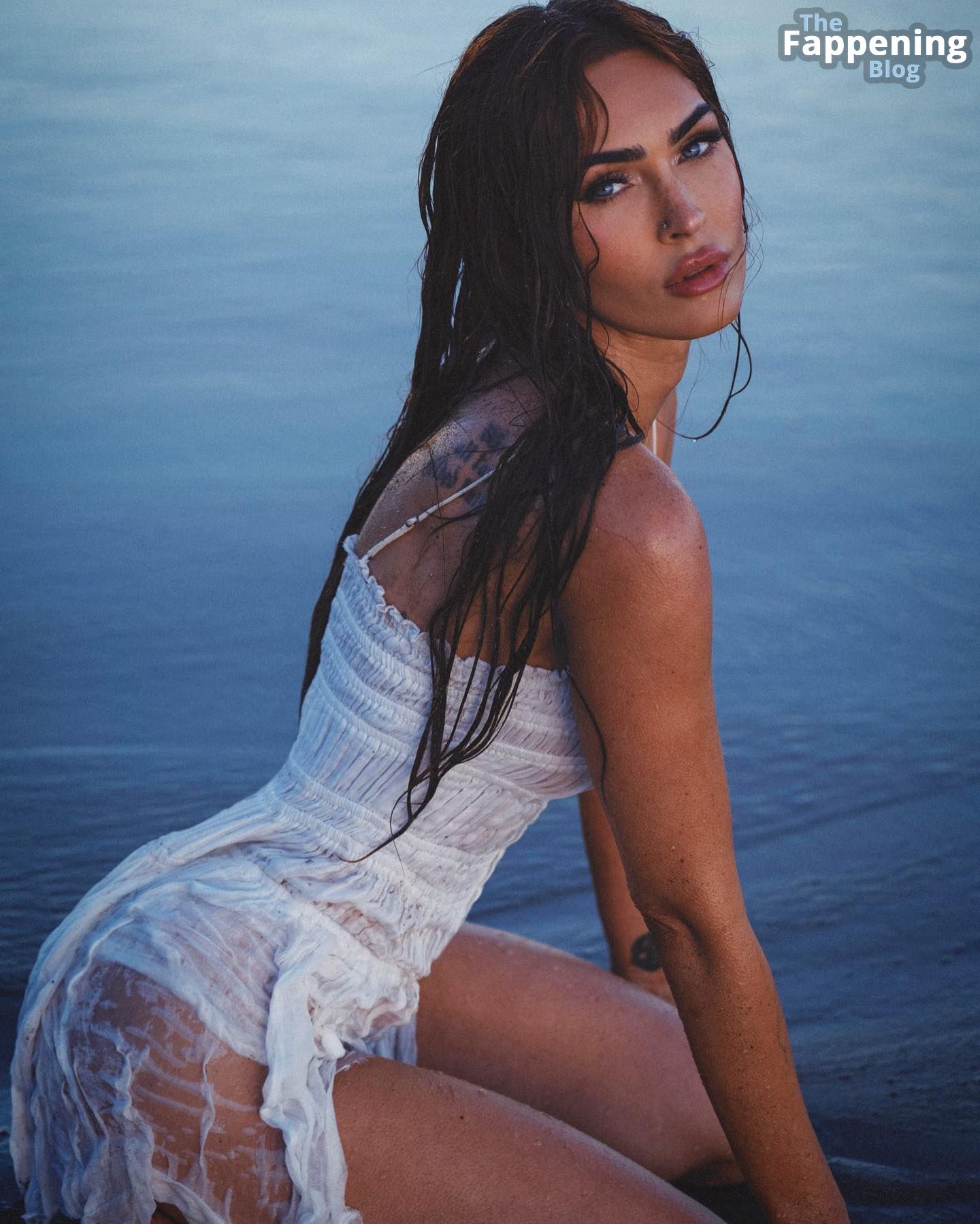 Megan Fox Poses on the Beach in a White Dress.jpg