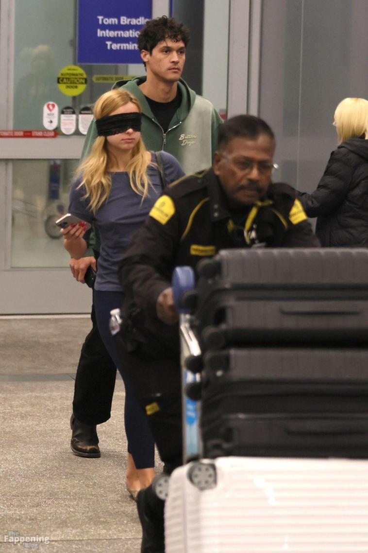 Addison Rae Walks Blindfolded Through LAX 28 Photos.jpg