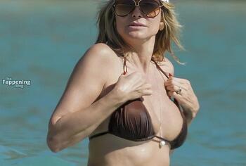 Heidi Klum nude on a beach