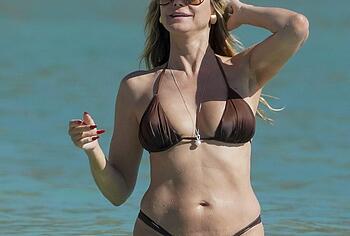 Heidi Klum nude on a beach