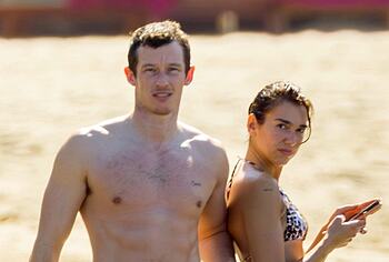 Dua Lipa bikini on a beach