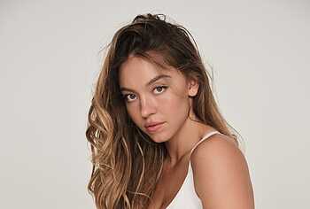 Sydney Sweeney posing in lacy lingerie